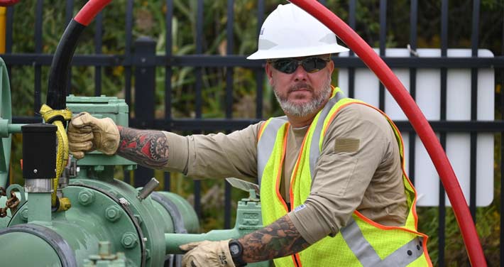 Unitil employee at pipe pig run event