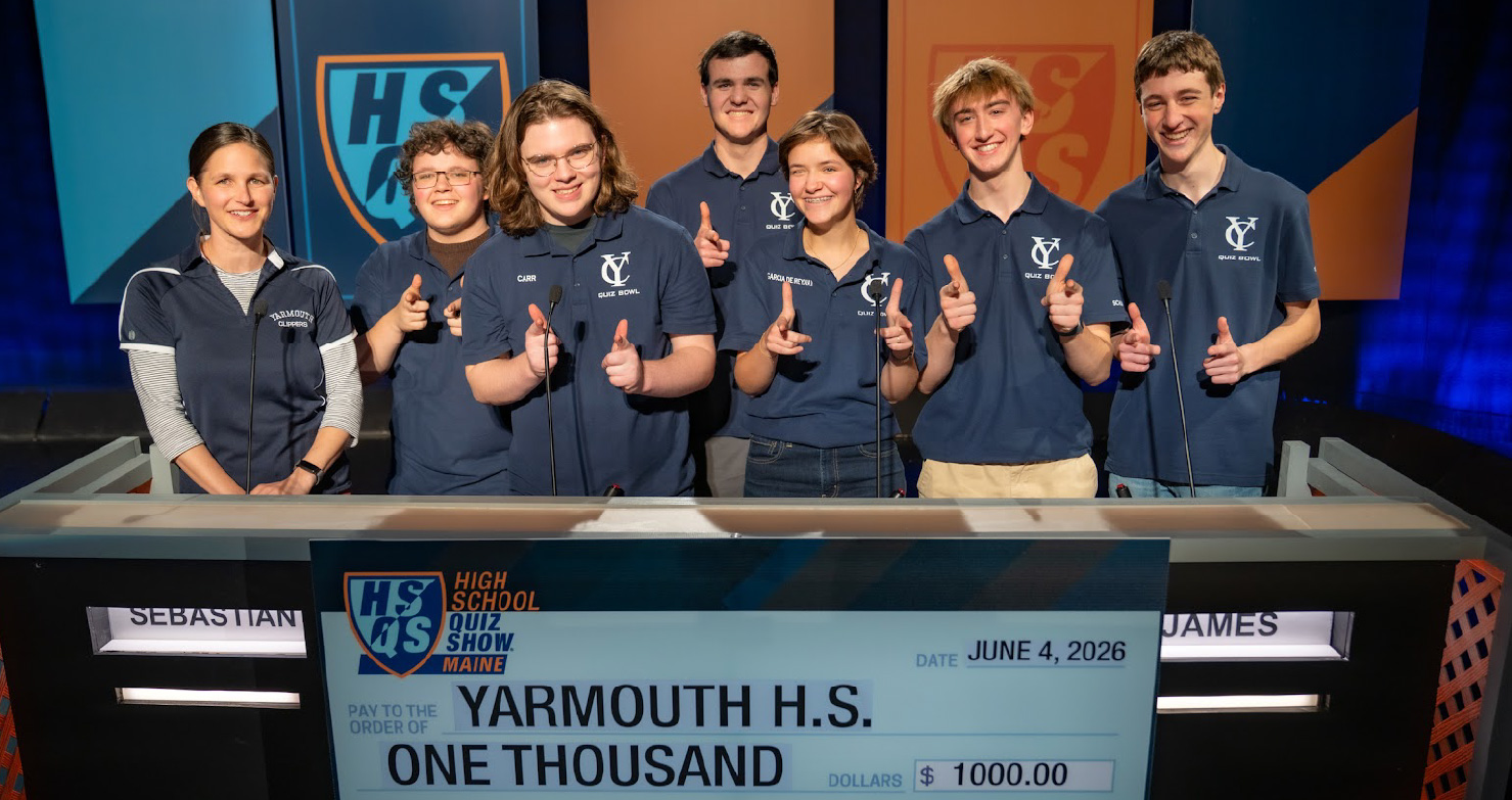 Yarmouth High School Quiz Show Team Smiling Behind Podium