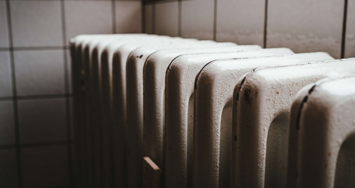 Closeup of an outdated heating unit.