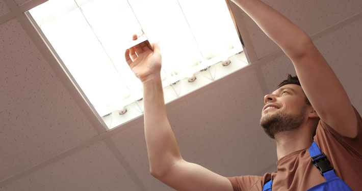 Man changing light bulb.