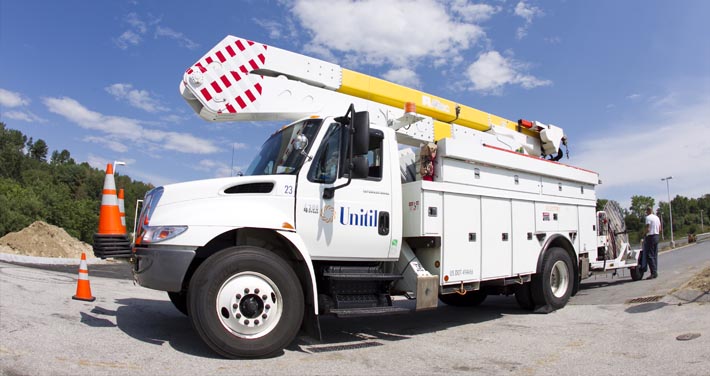 Unitil electric truck with safety cones on front