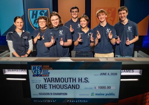 Yarmouth High School Quiz Show Team Smiling Behind Podium
