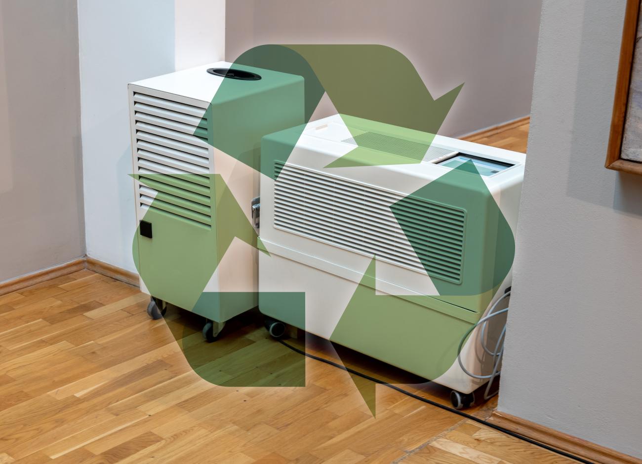 An opaque recycling sign glows in front of outdated dehumidifiers